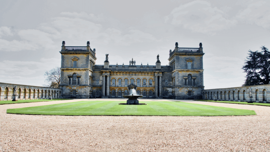 a large building with a fountain in front of it