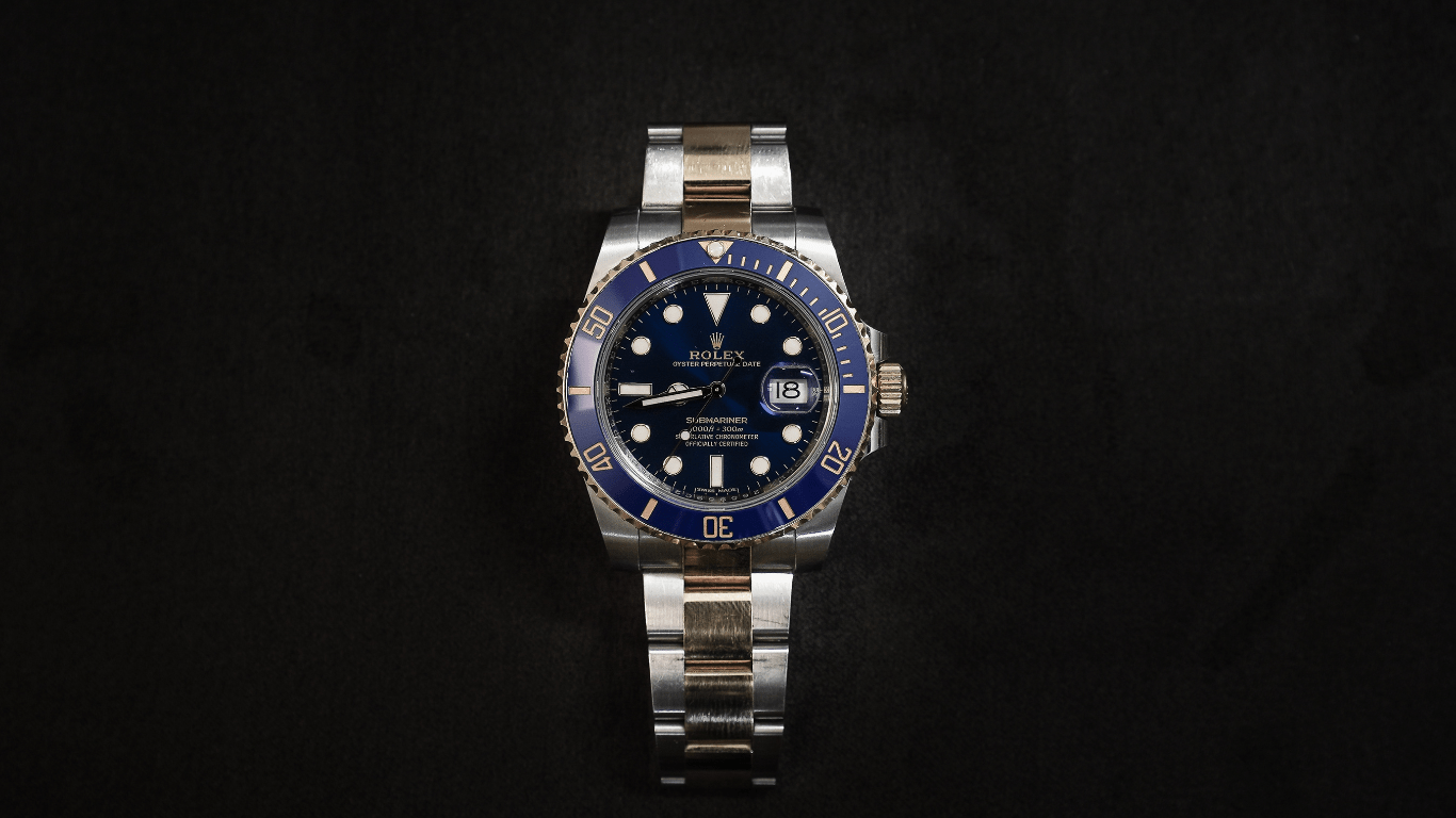 a rolex watch on a black background