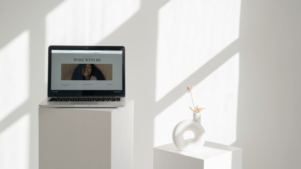 a laptop sitting on top of a white couch