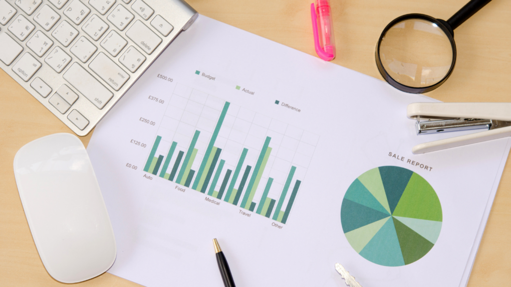 a magnifying glass and a pen on top of a business report