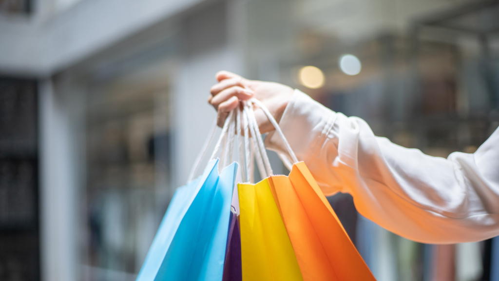 a person walking down the street with shopping bags