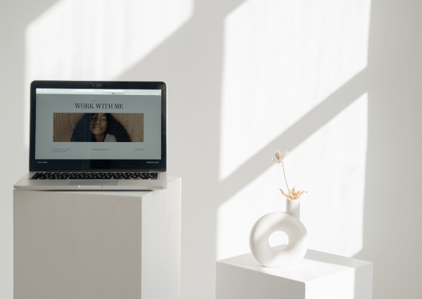 a laptop sitting on top of a white couch